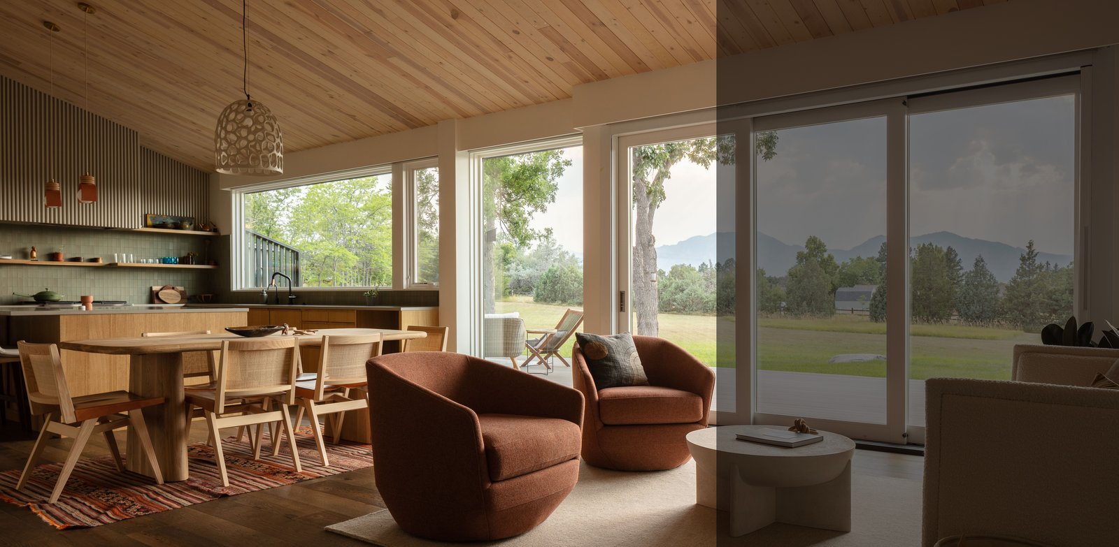 Sunlit living room with floor-to-ceiling windows